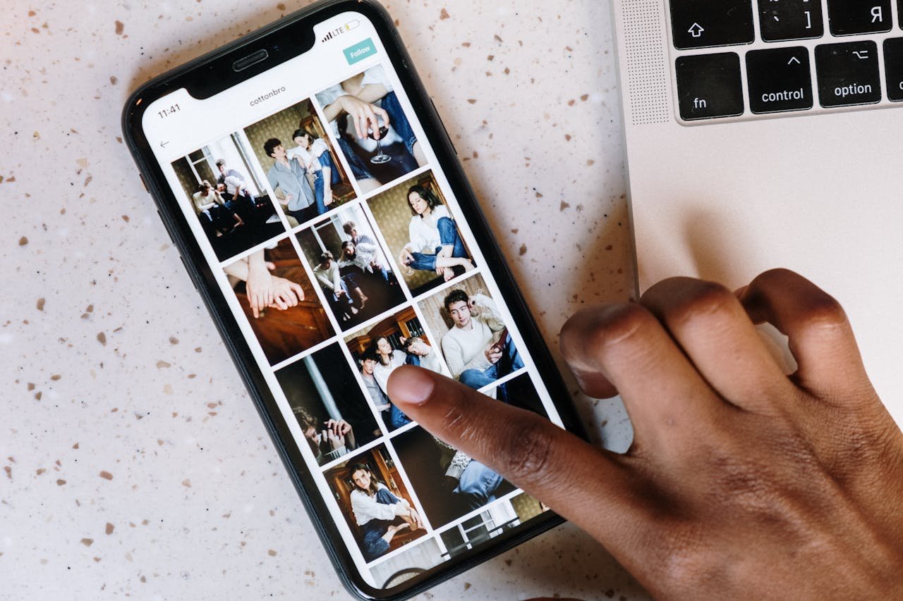 A person is selecting photos on mobile