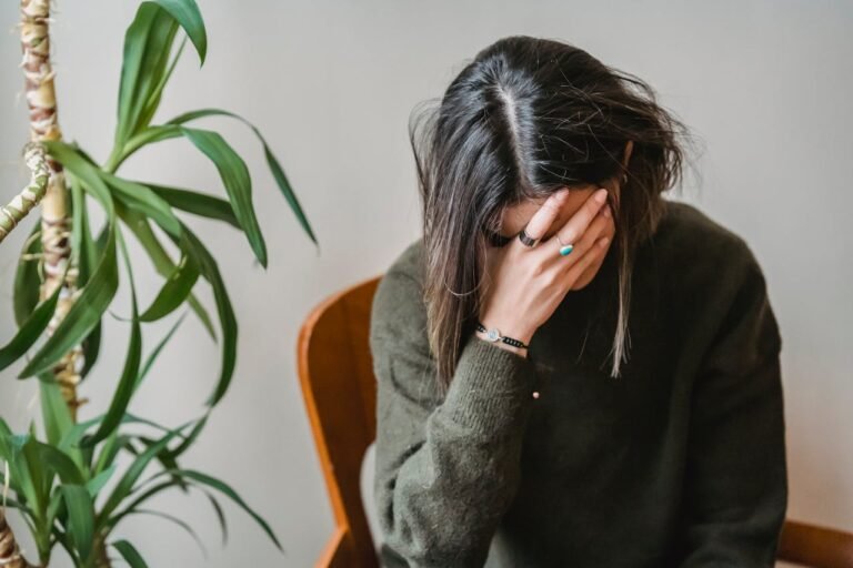 A women in office and thinking something