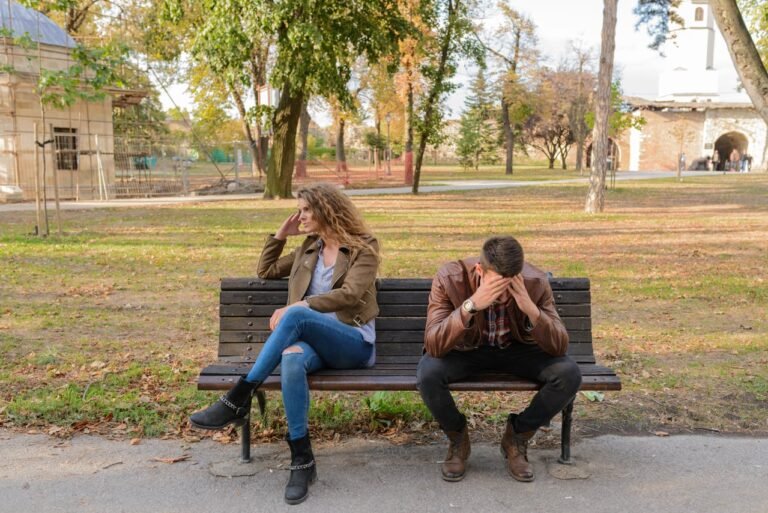 Woman And Man Sitting on Bench